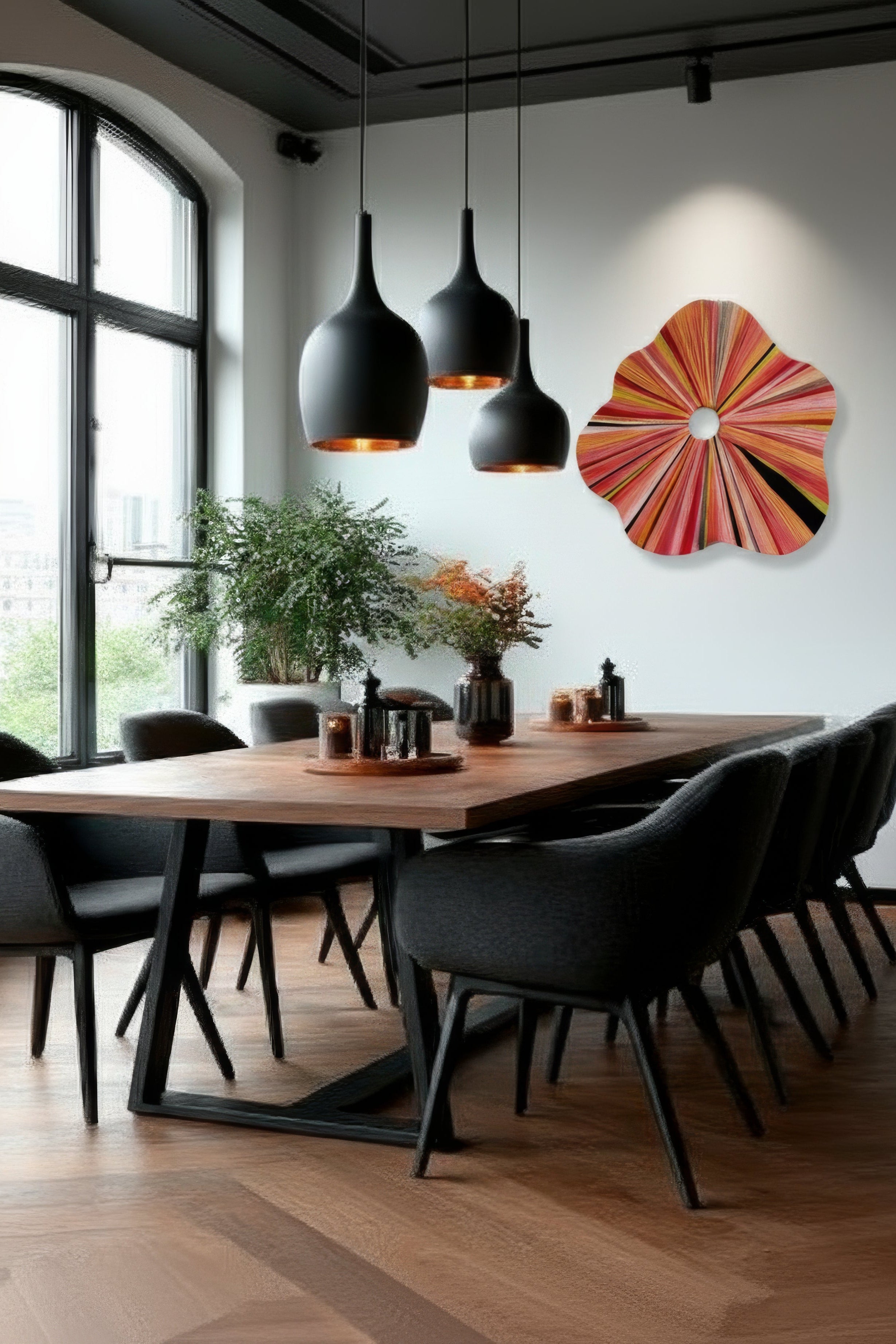 Modern dining room with wooden table, gray chairs, and colorful wall art.