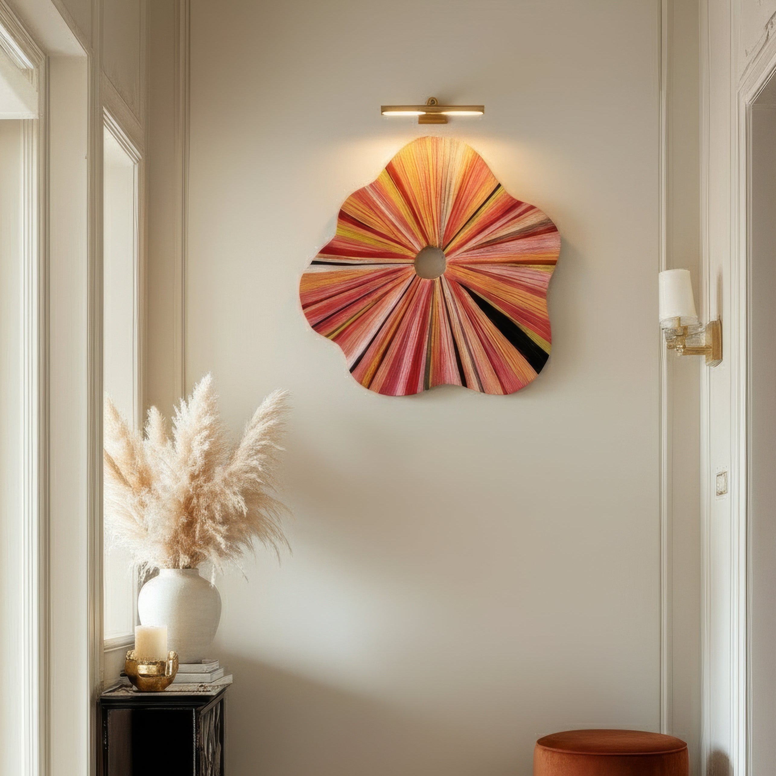 Decorative wall art in a room with a rug and side table.