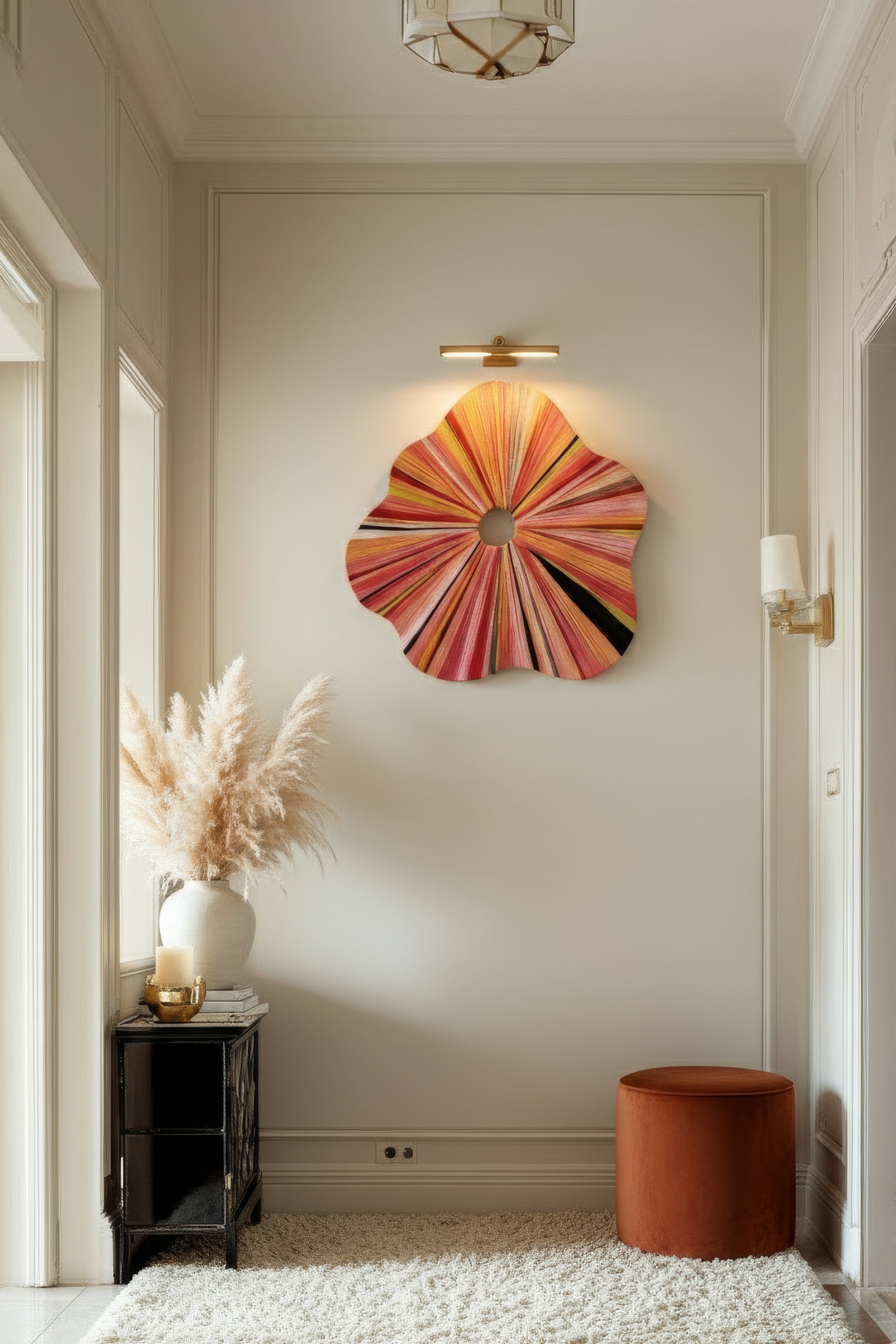 Decorative wall art in a room with a rug and side table.
