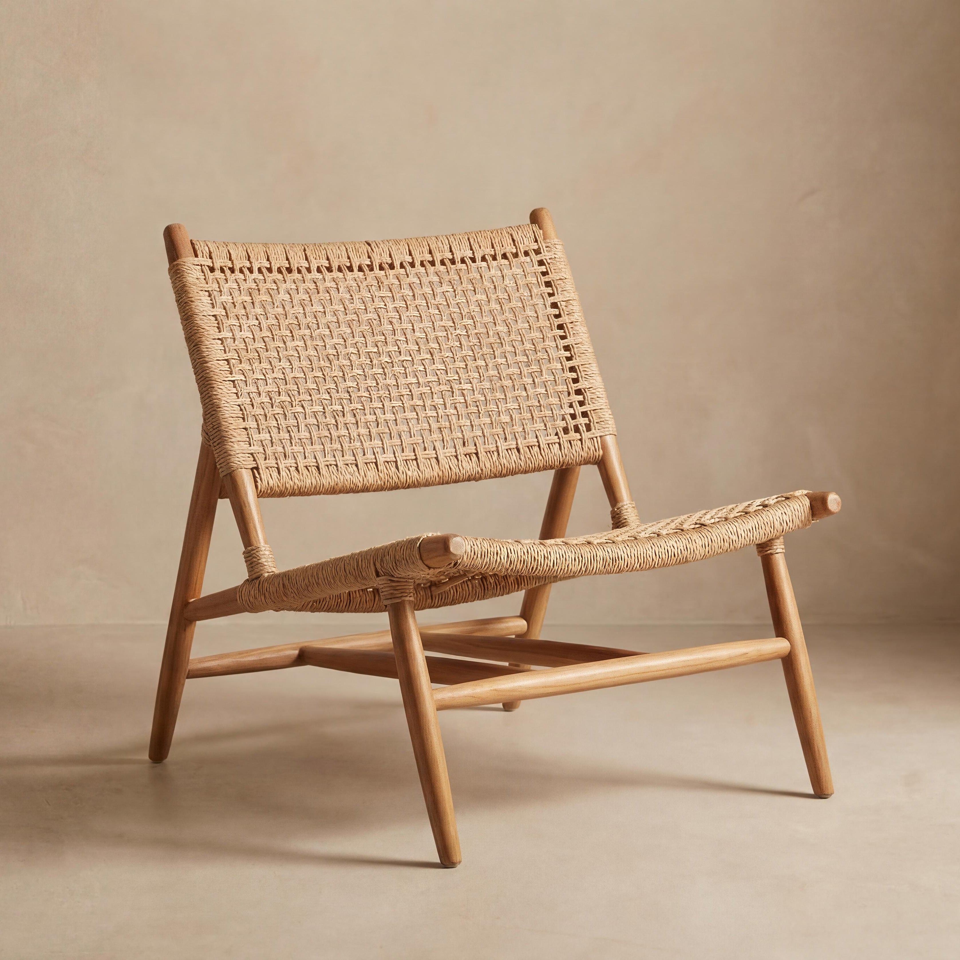Woven chair and ottoman set on a beige background