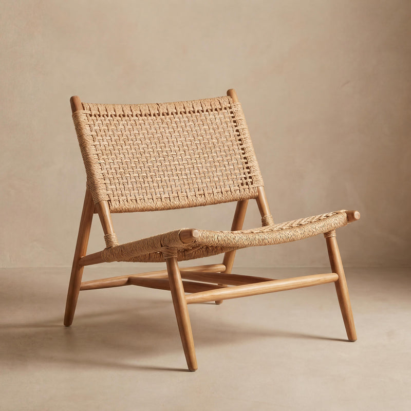 Woven chair and ottoman set on a beige background