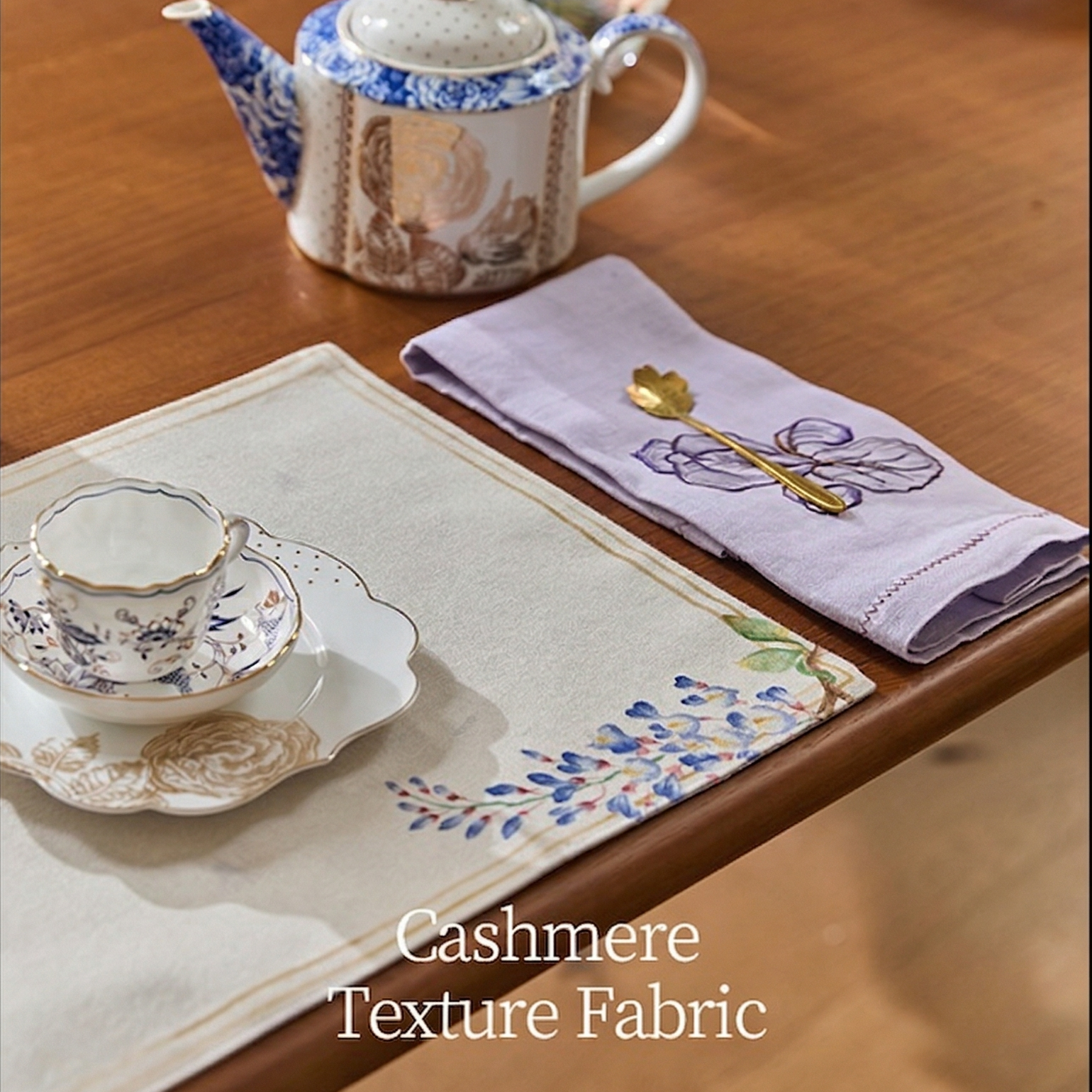 Tea set with cashmere texture fabric on a wooden table