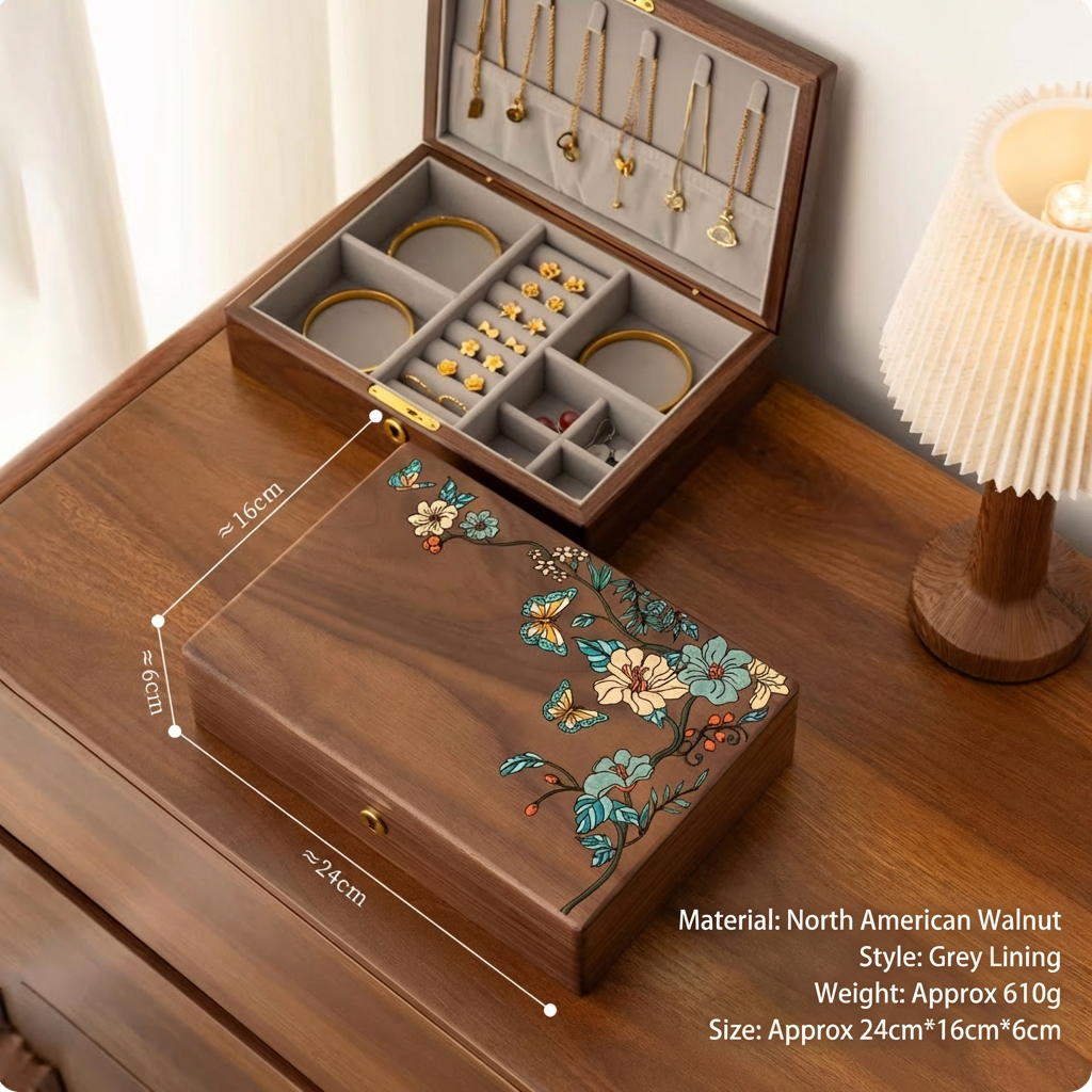 Wooden jewelry box with floral design on a wooden surface, containing jewelry.