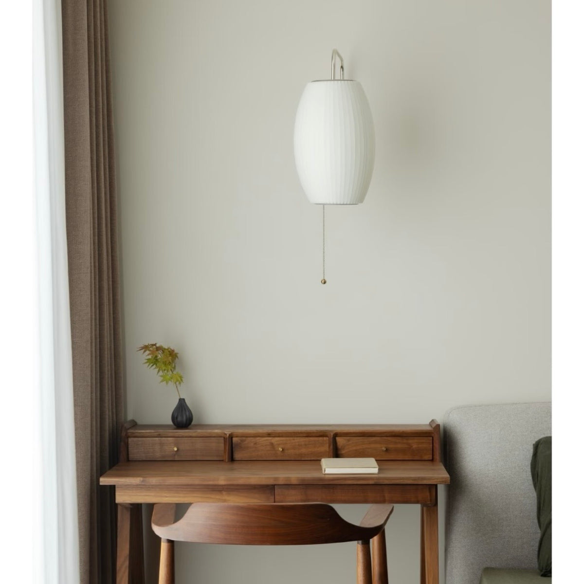 Plug-in globe wall sconce with a soft, diffused glow