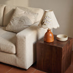 Lily of the Valley table lamp with carved wood base, in a room