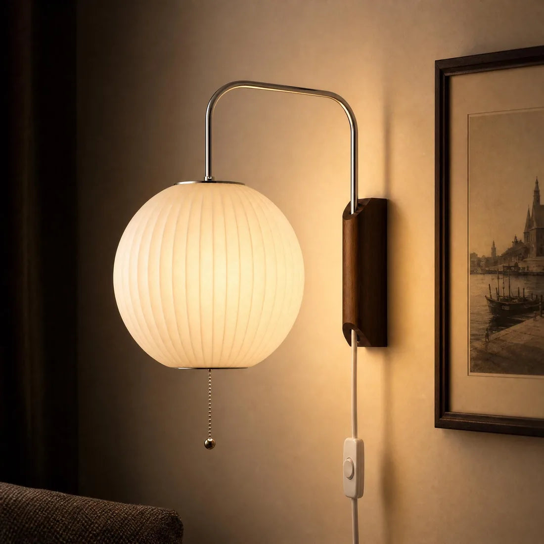 Close view of the Globe Shuttle Sconce's pleated shade and wooden bracket
