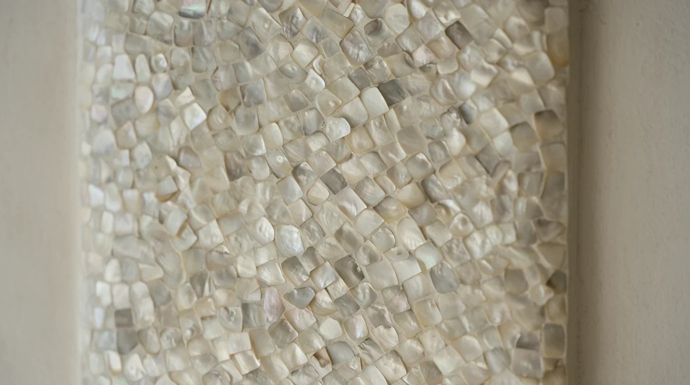 Close-up of small shell pieces set as a mosaic
